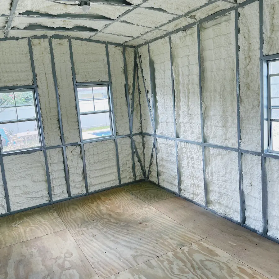 Closed-cell spray foam insulation applied to wall cavities in a residential project in Mexia
